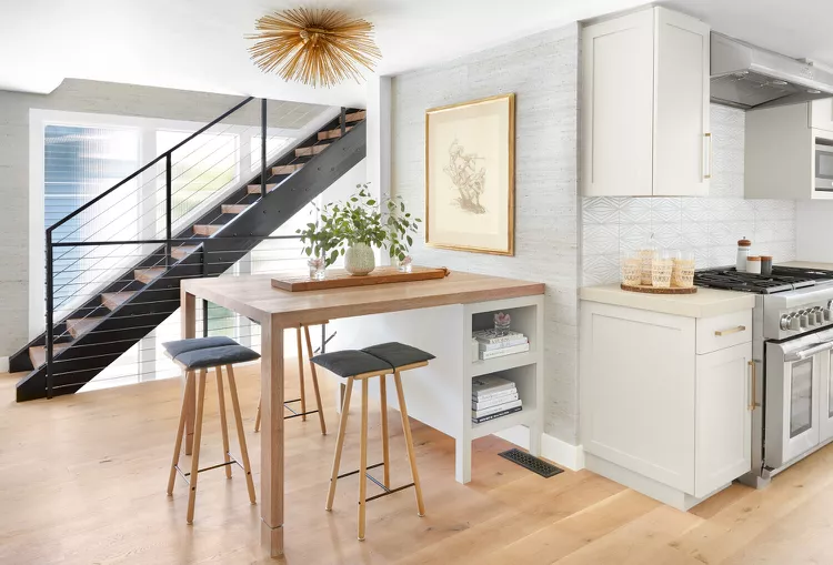 Modern industrial cable stairs showing sleek stair railing ideas indoor with black metal frames and thin horizontal wire cables.